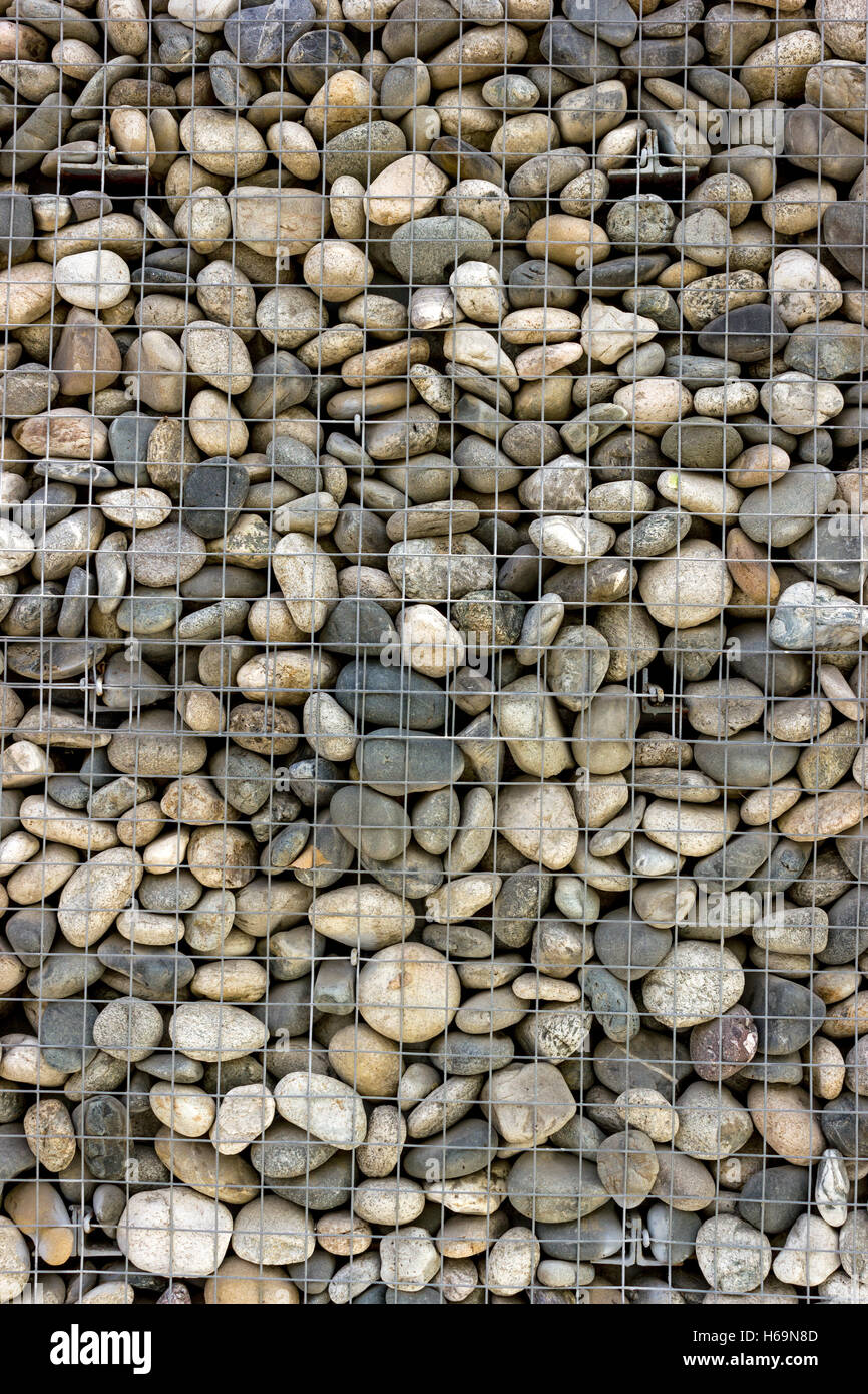 Backgrounds collection - The decorative stone wall built of sea pebbles Stock Photo