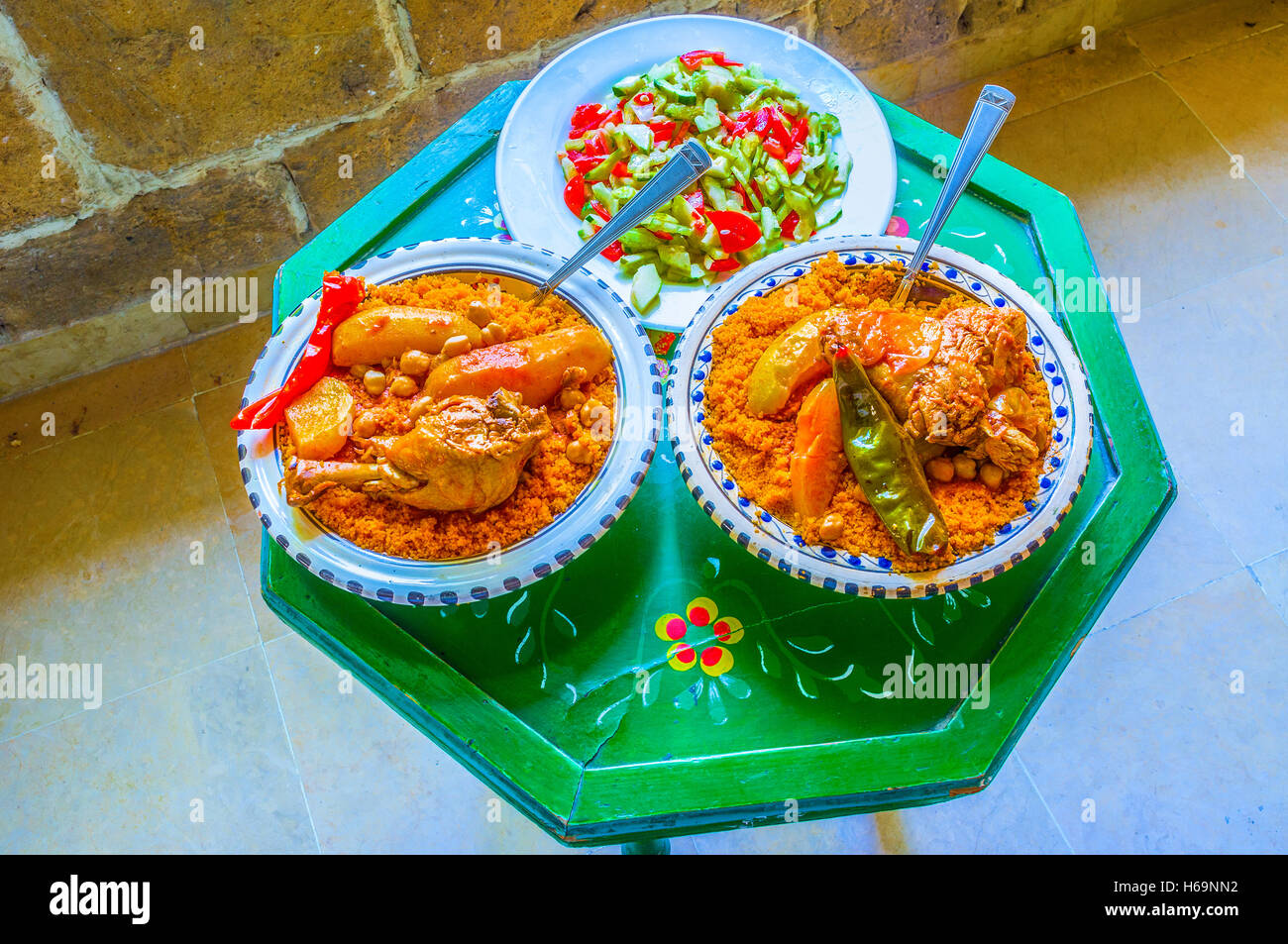 The traditional Tunisian dinner includes vegetable salad and couscous