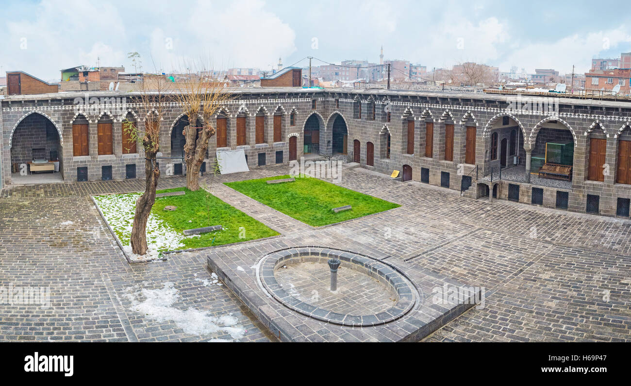 The view of the courtyard of Cemil Pasha mansion with the small fountain and decorated basalt walls Stock Photo
