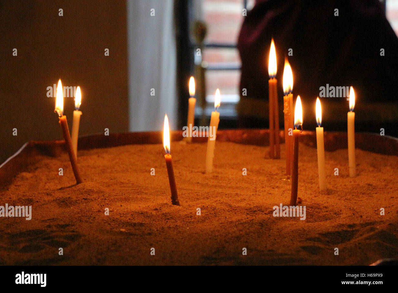 Candles burning over dark background in a church Stock Photo Alamy