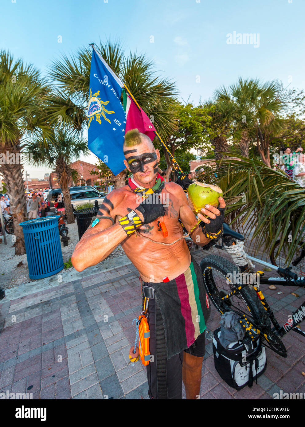 Crazy, joyous sunset scene nightly at Mallory Square in Key West. Here, a drummer performs. Stock Photo