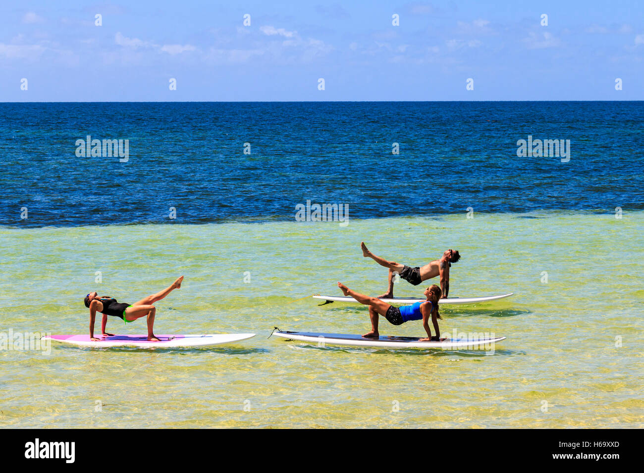 Yoga on a stand up paddle board, taught at Bahia Honda State Park along the Florida Keys by Serenity Eco Therapy. Stock Photo
