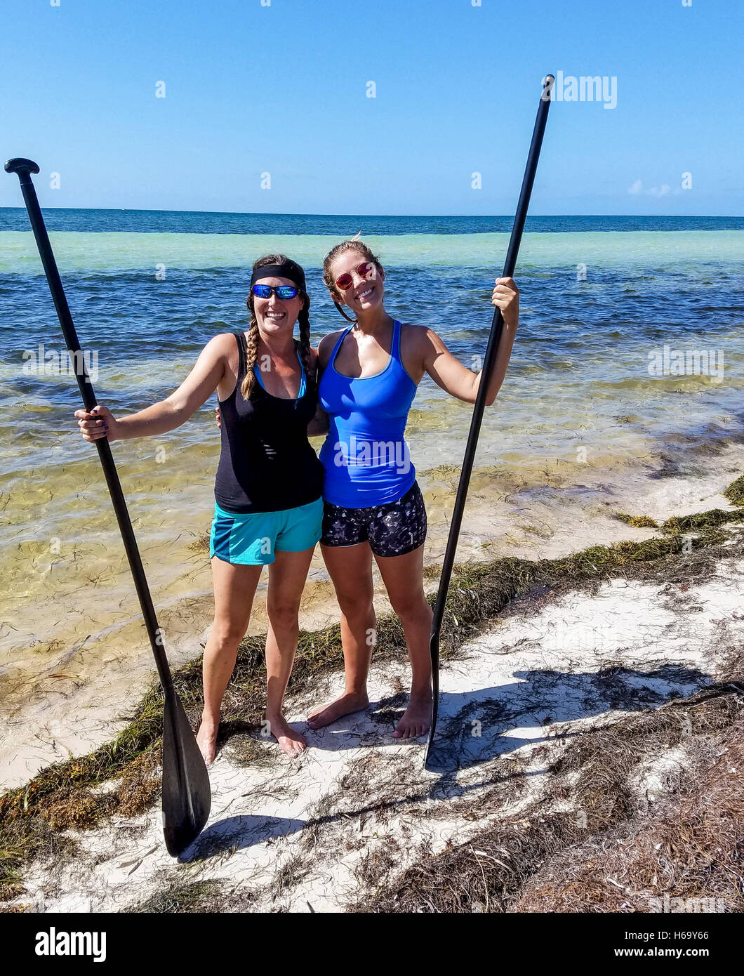 Stand up paddle boarding with Sarah and Allison of Serenity Eco Therapy at Bahia Honda State Park in the Florida Keys. Stock Photo