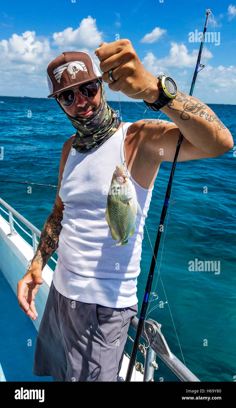 Fishing with Robbie's off islamorada. Here, a fisherman shows off his French grunt. Stock Photo
