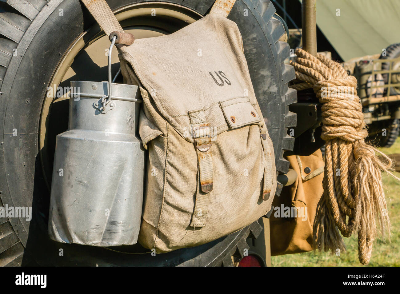 US military bag and gasoline jerrycan on a jeep expostion Stock Photo