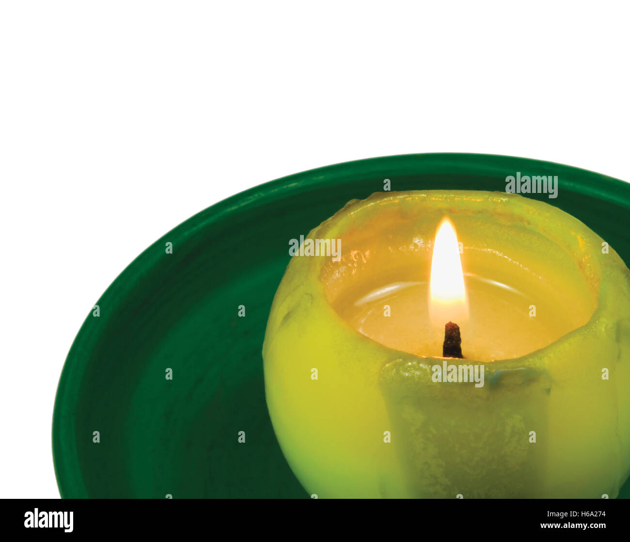 Green lit candle macro closeup, isolated glowing flame Stock Photo Alamy