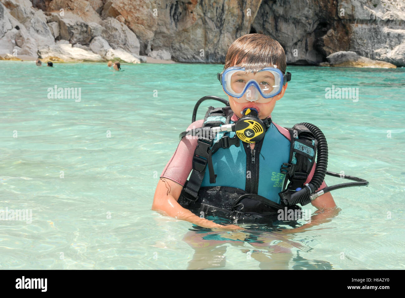 Cala Mariolu, Italy - 28 June 2013: Child discover scuba diving at Cala Mariolu beach on Sardinia, Italy Stock Photo