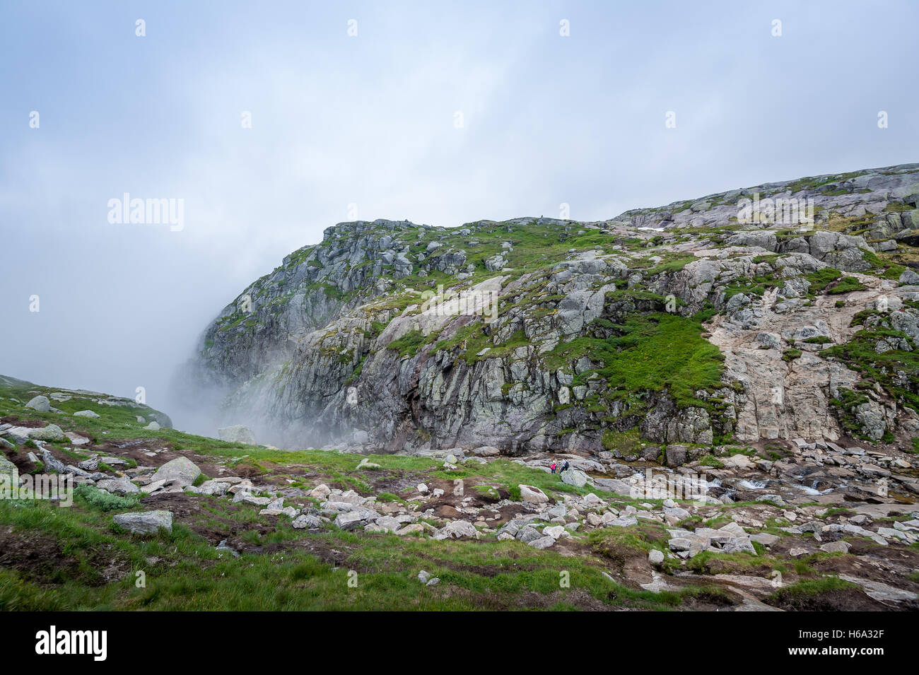 Tourists at the scenic landscape of Kjerag hiking path. Stock Photo