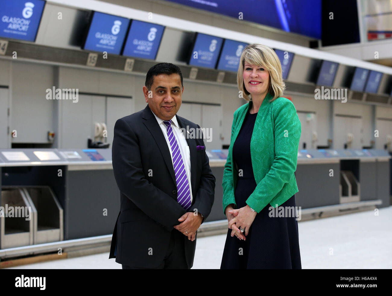 Aviation Minister Lord Ahmad during a visit to Glasgow Airport where he met the airport's Chief Executive Amanda McMillan (right) and outlined the advantages of the expansion announced yesterday of Heathrow airport with the planned construction of a third runway. Stock Photo