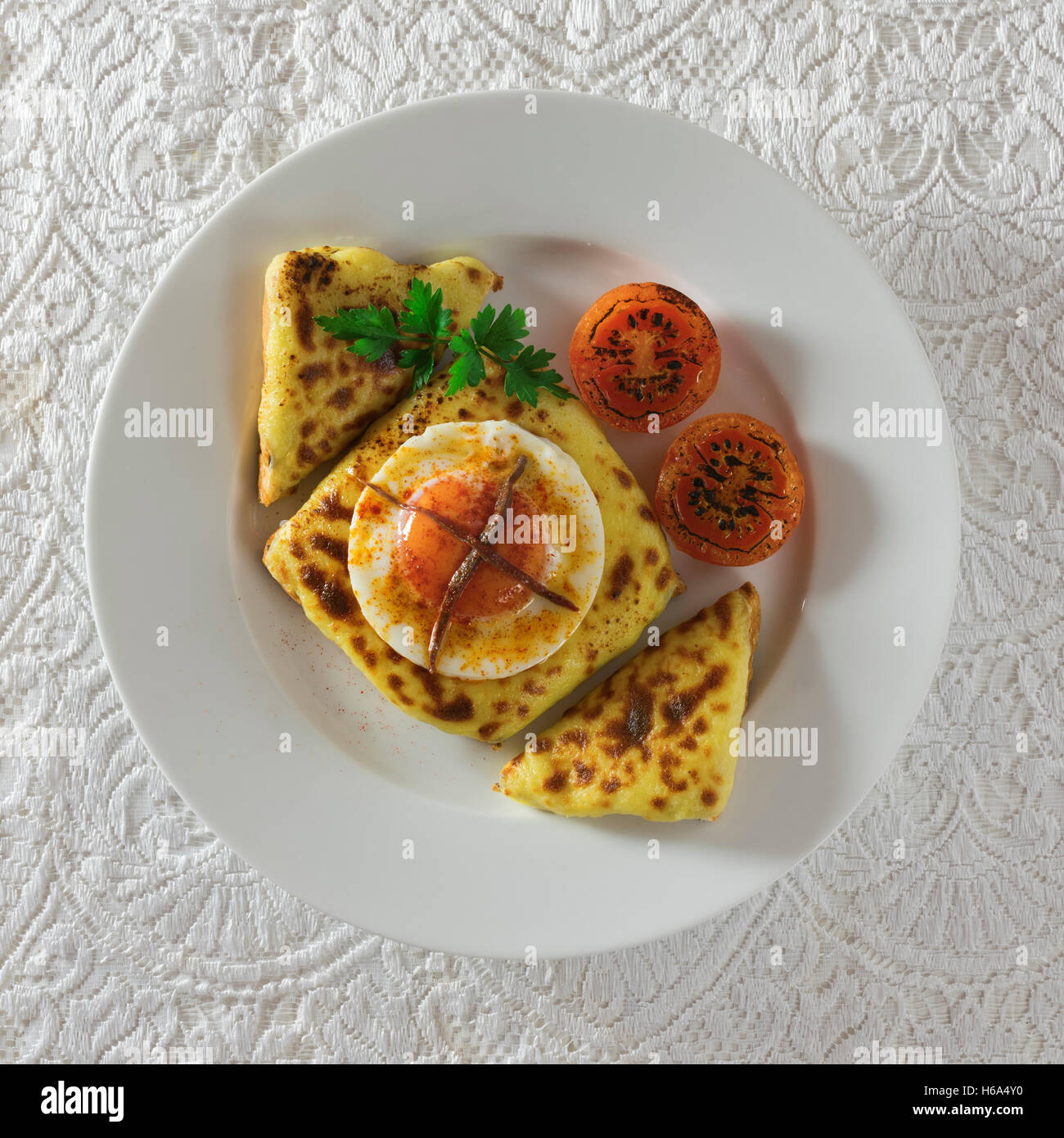 Buck rarebit. Grilled cheese topping on toast with a poached egg. Stock Photo