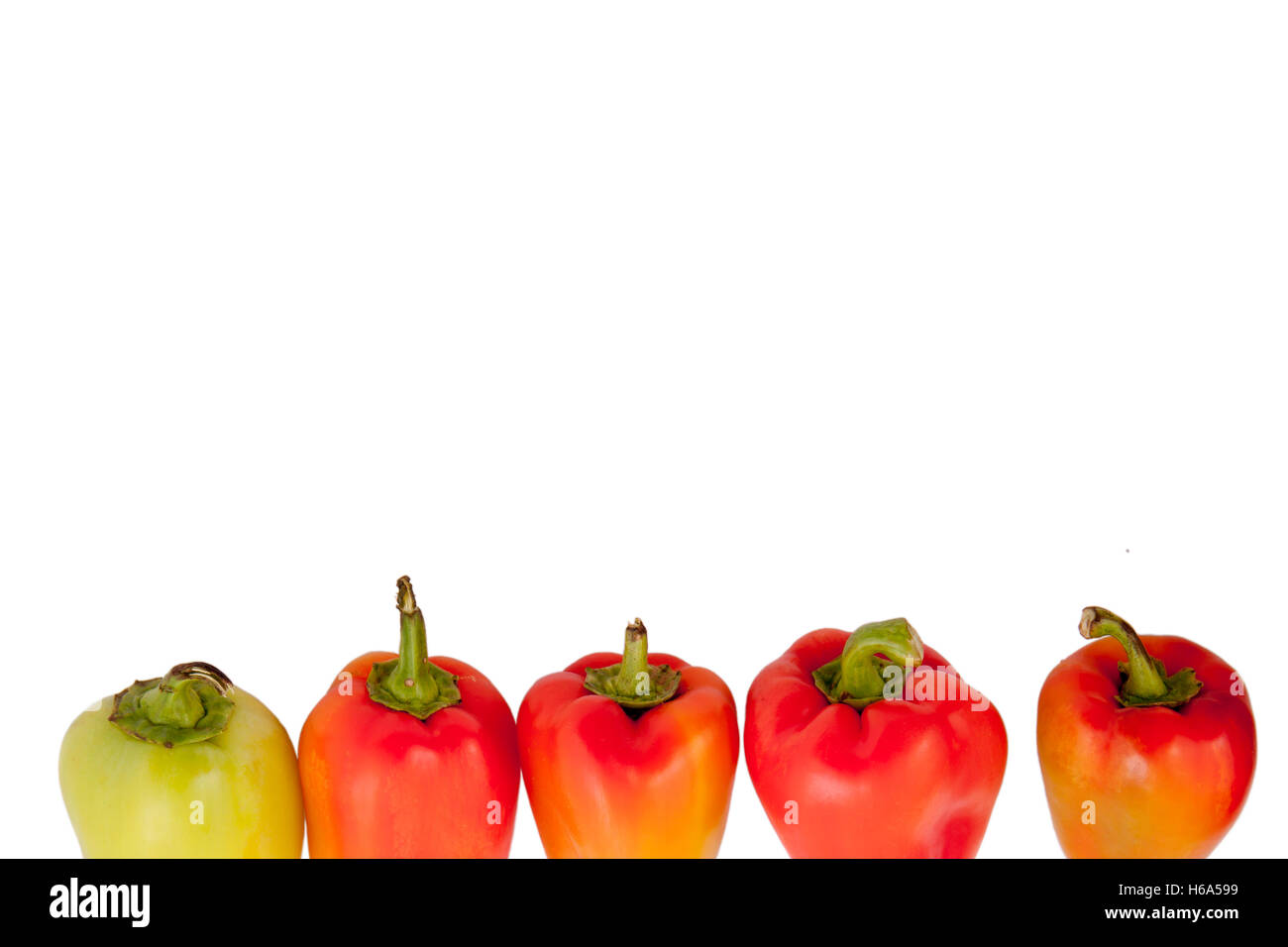 red and yellow peppers isolated on white background Stock Photo - Alamy