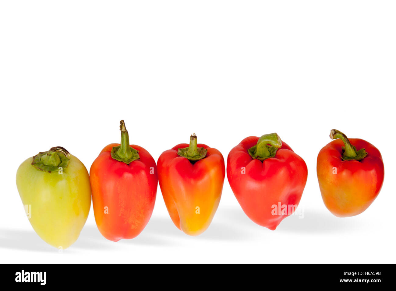 red and yellow peppers isolated on white background Stock Photo - Alamy