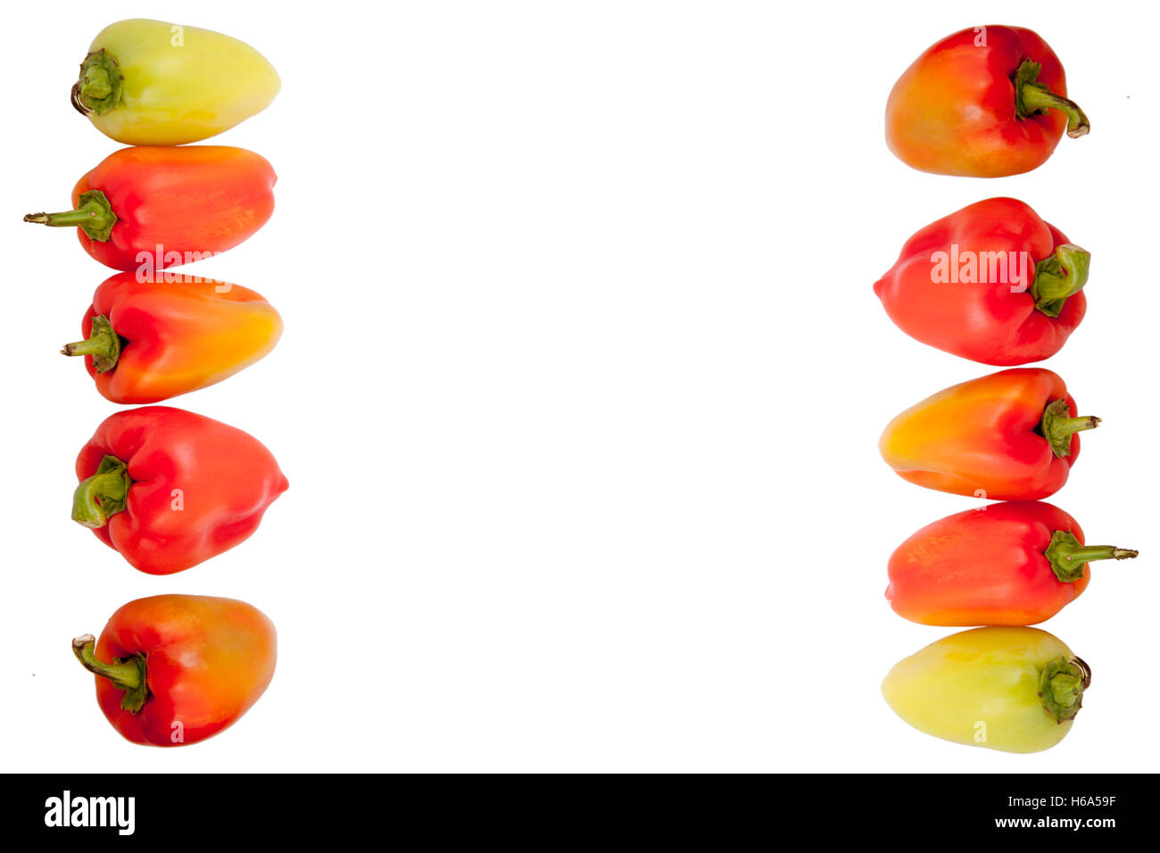 red and yellow peppers isolated on white background Stock Photo - Alamy