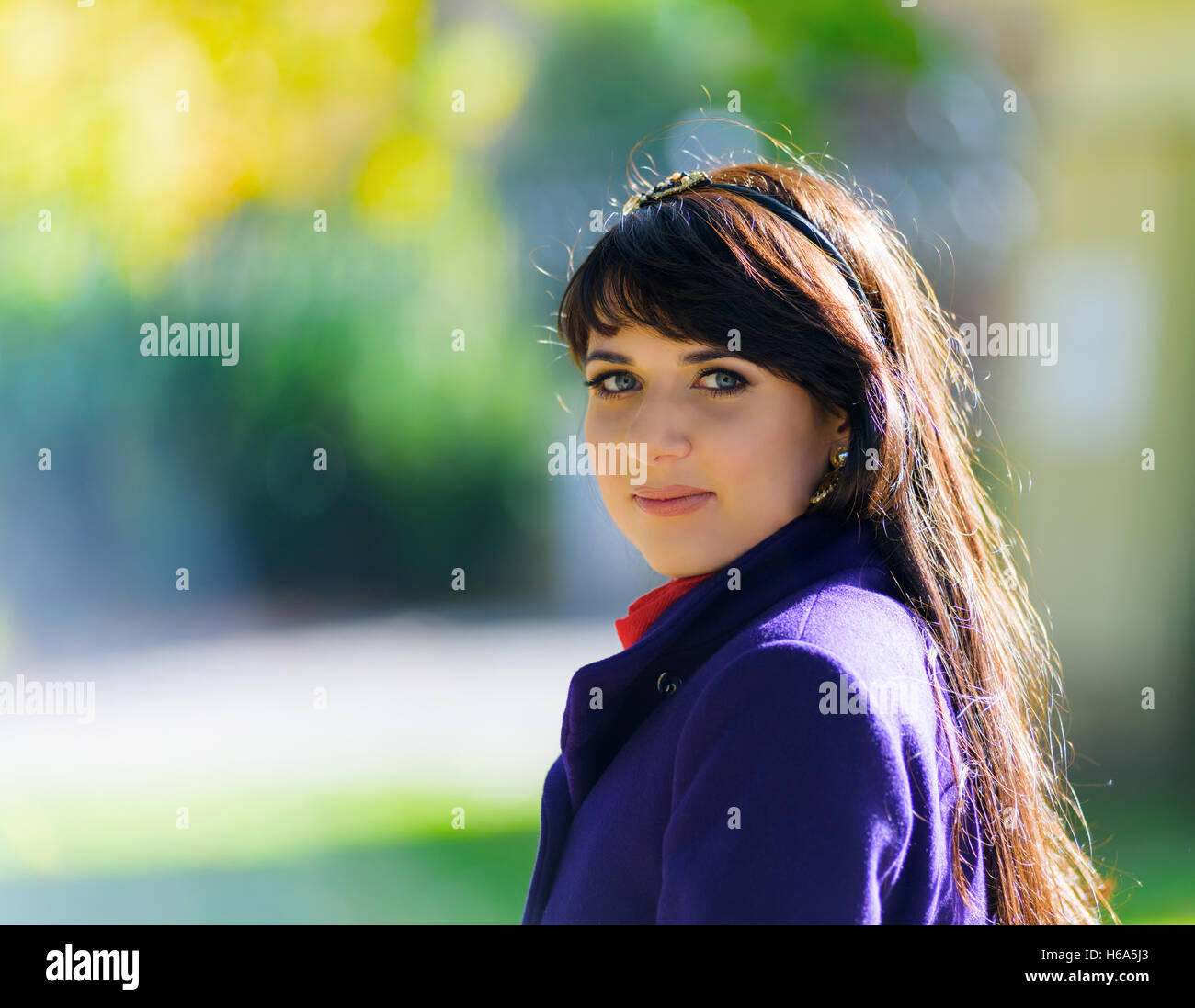 Portrait of woman in the park Stock Photo - Alamy
