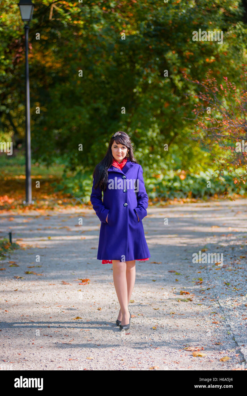 Young woman walking in the park Stock Photo - Alamy