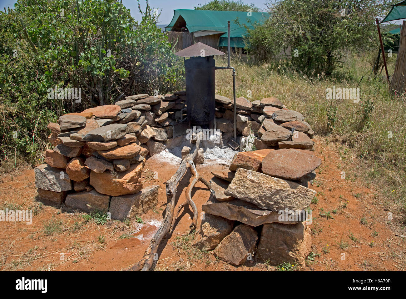 Modified Rhodesian boiler producing hot water Laikipia Wilderness camp Nanyuki Kenya Stock Photo