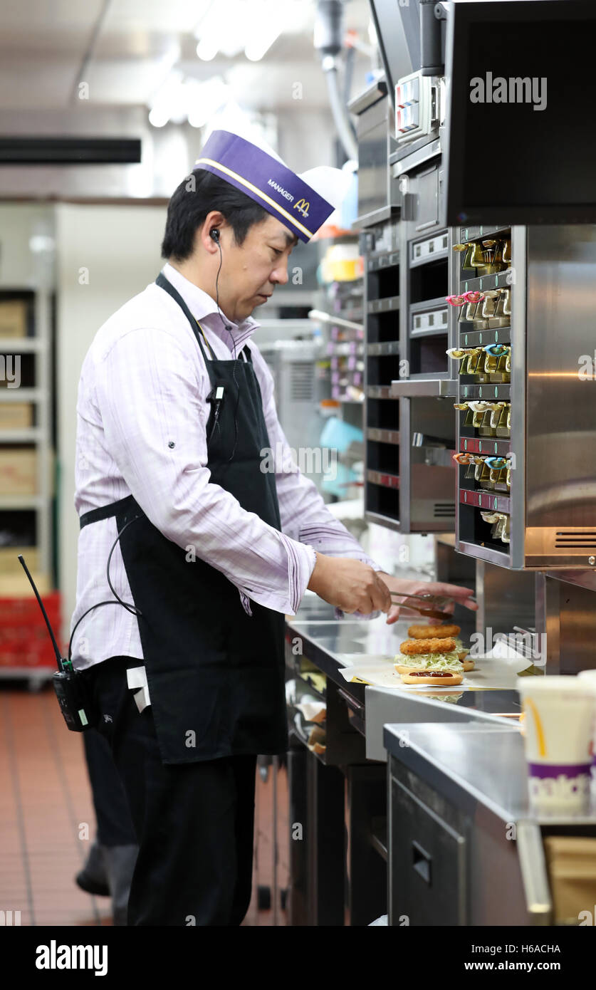 Tokyo, Japan. 26th Oct, 2016. An employee of Japan McDonald's cooks new
