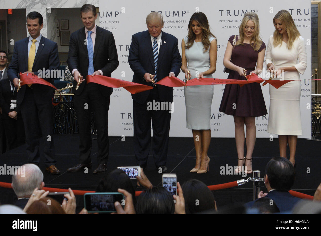 Washington, DC, USA. 26th Oct, 2016. Presidential Candidate Donald Trump as well as his wife Melania and four of his children (Donald Trump Jr., Eric Trump, Tiffany Trump, and Ivanka Trump) in the Grand Lobby of the Trump International Hotel in Washington, DC cutting an official ribbon to celebrate its official grand opening. Credit:  Evan Golub/ZUMA Wire/Alamy Live News Stock Photo