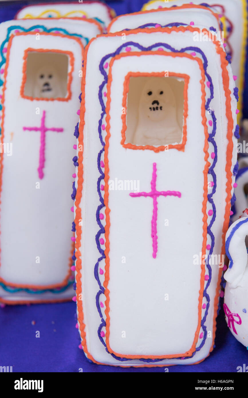 Decorated folk art sugar coffins representing departed soul on sale at a street market in preparation for the Day of the Dead festival October 26, 2016 in Comonfort, Guanajuato, Mexico. The celebration is a time when Mexicans welcome the dead back to earth for a visit and celebrate life. Stock Photo