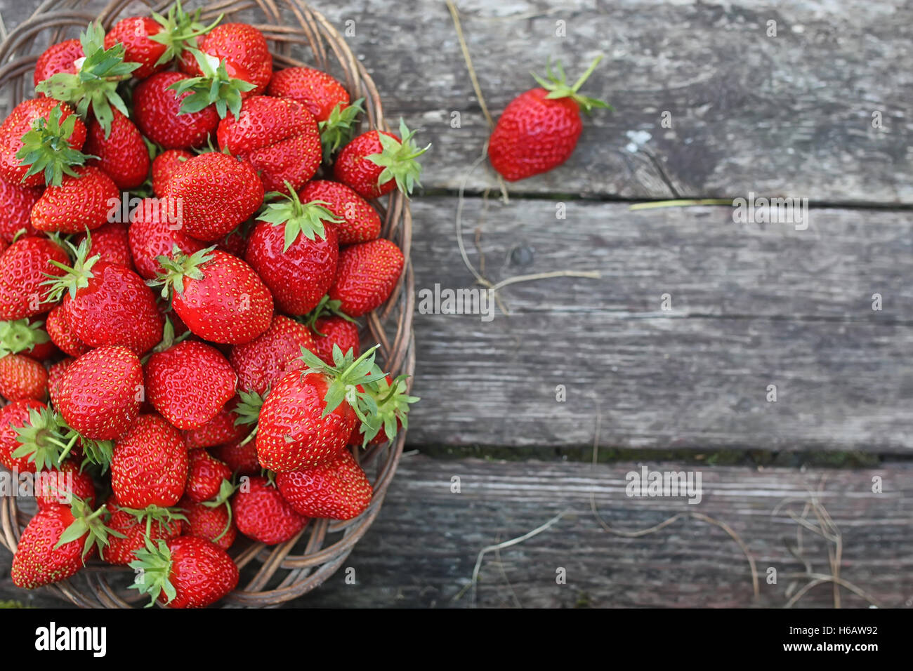 Strawberry on rustic wooden background Stock Photo - Alamy