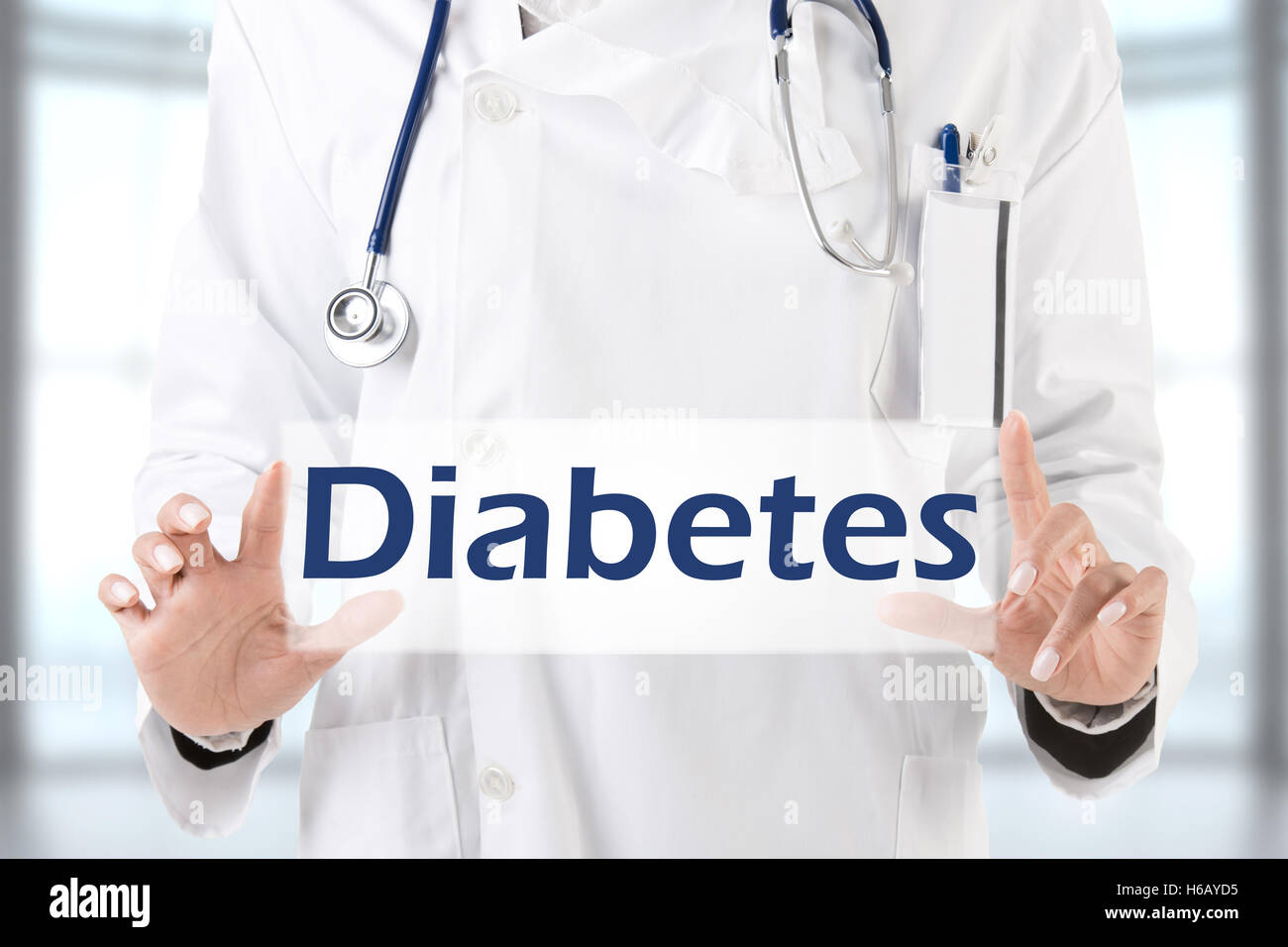 Female doctor holding a placeholder with the word Diabetes Stock Photo