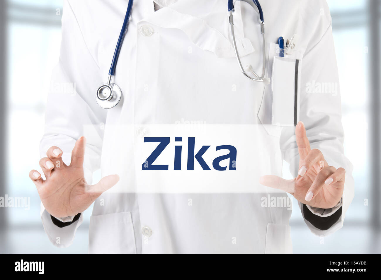 Female doctor holding a placeholder with the word Zika Stock Photo