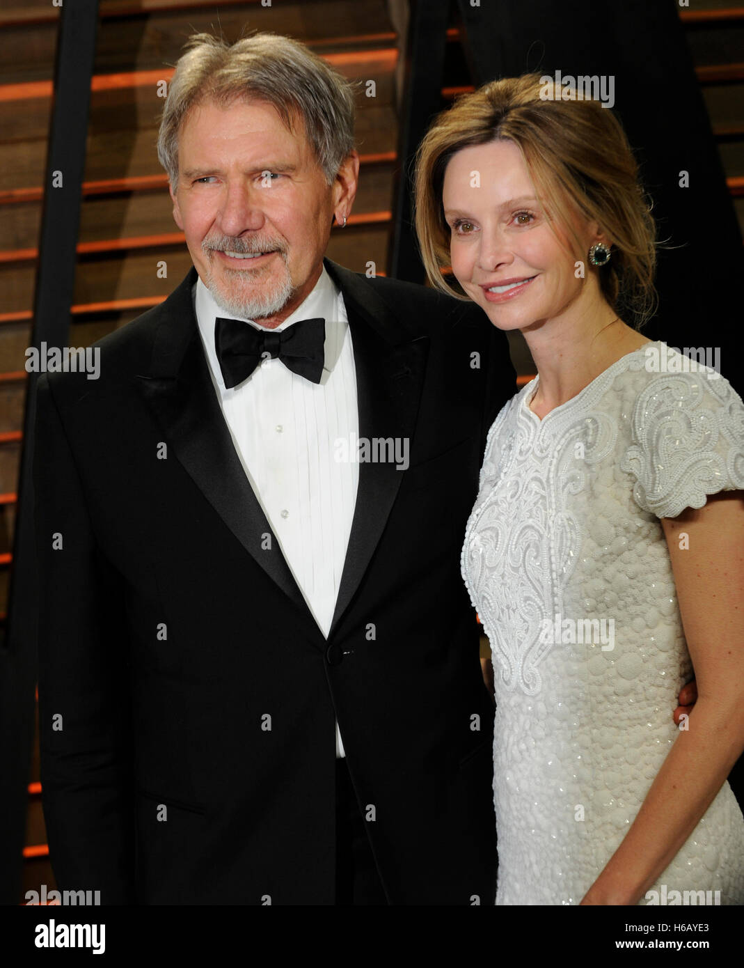 Actors Harrison Ford (L) and Calista Flockhart attends the 2014 Vanity Fair Oscar Party on March 2, 2014 in West Hollywood, California. Stock Photo