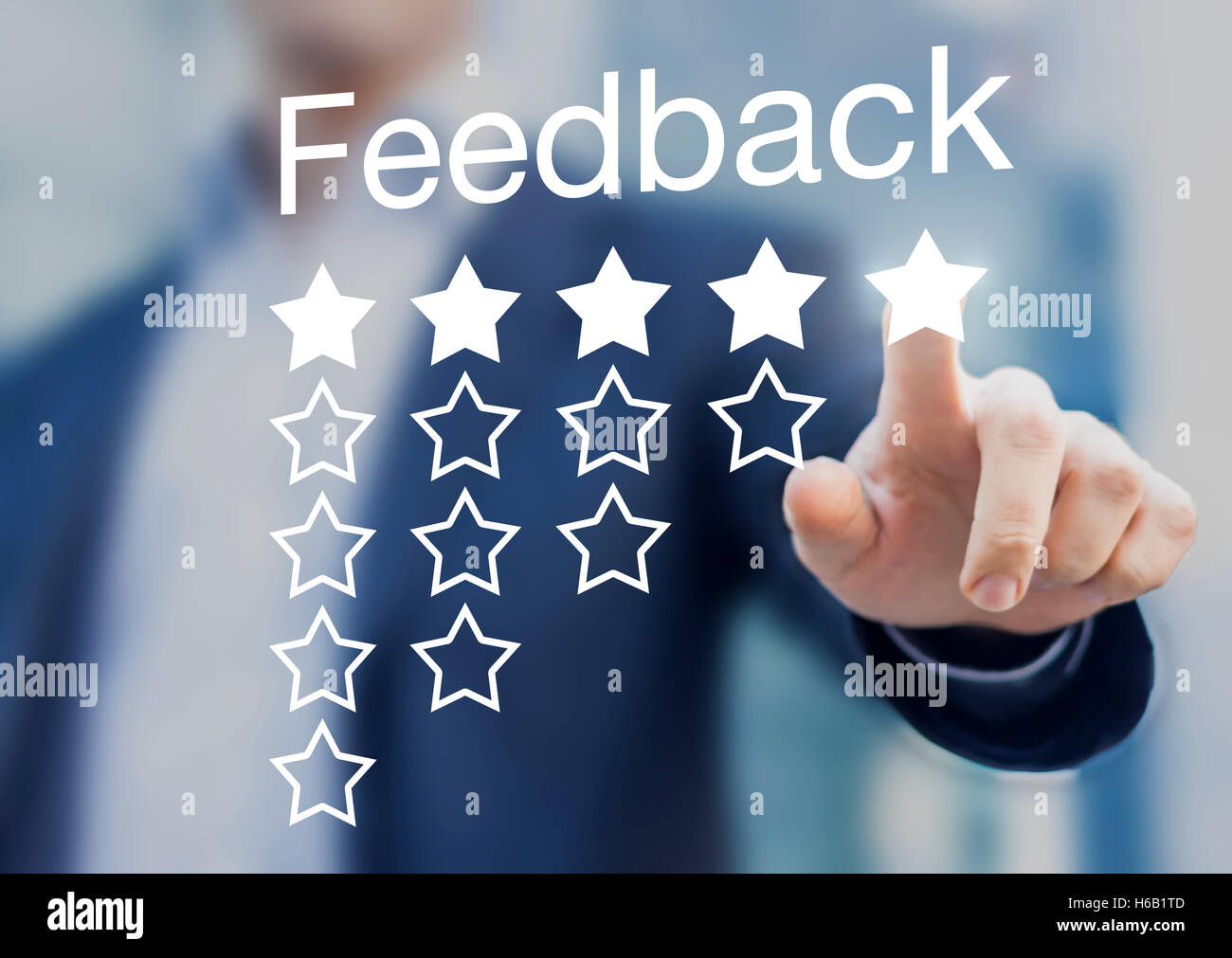 Satisfied customer pushing a five-star feedback rating button on a virtual interface application Stock Photo