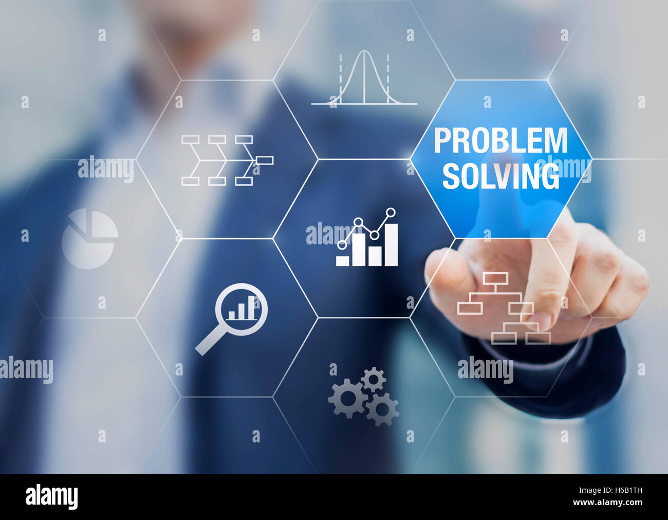 Problem solving concept with root cause diagram and quality controls charts on a transparent touch screen with a businessman Stock Photo