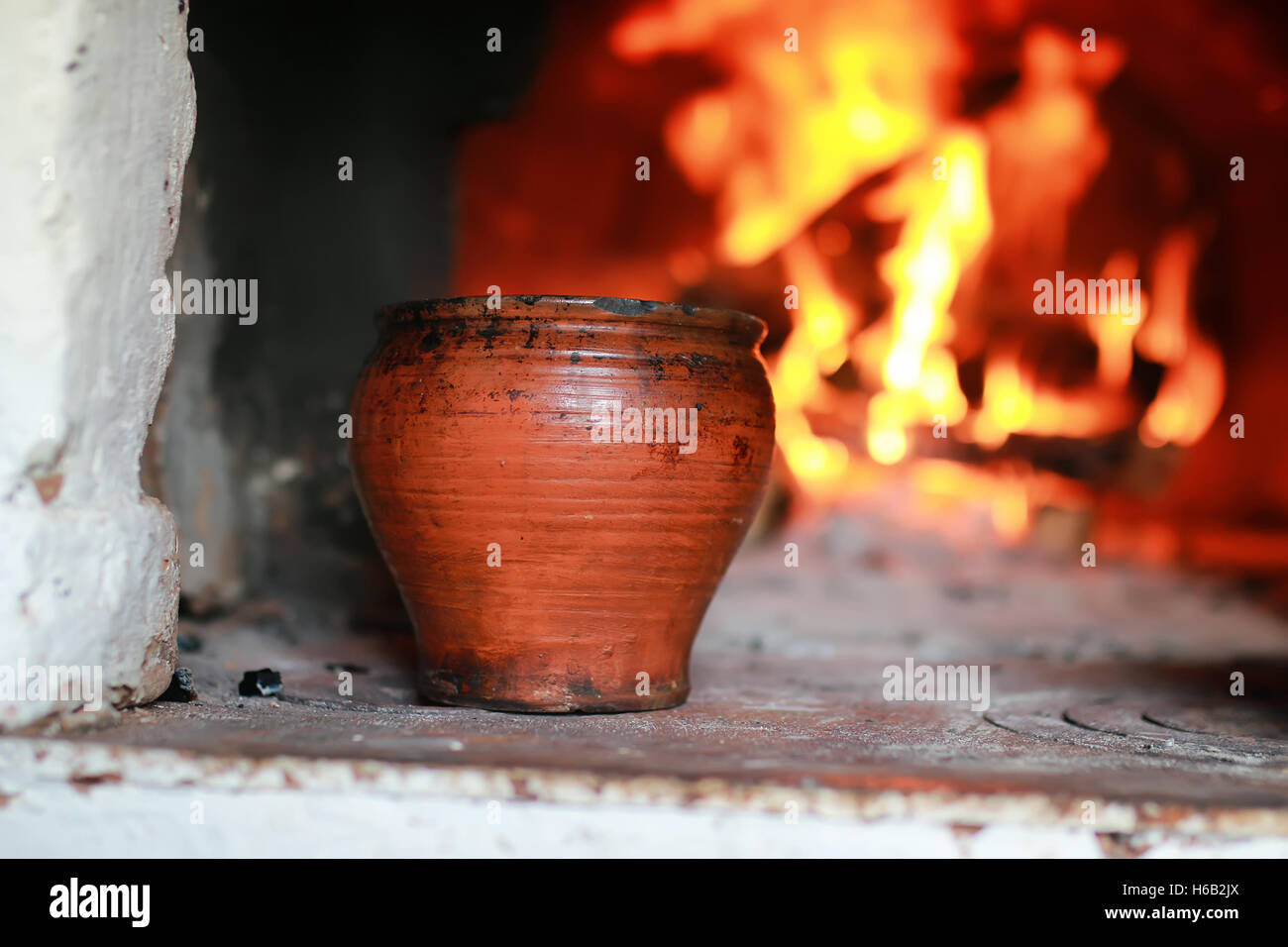 pot in the oven with food the oven fork Stock Photo Alamy