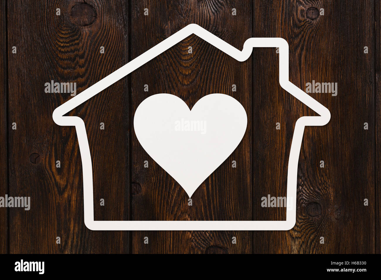 Paper house with heart inside. Love, relations, family abstract concept Stock Photo