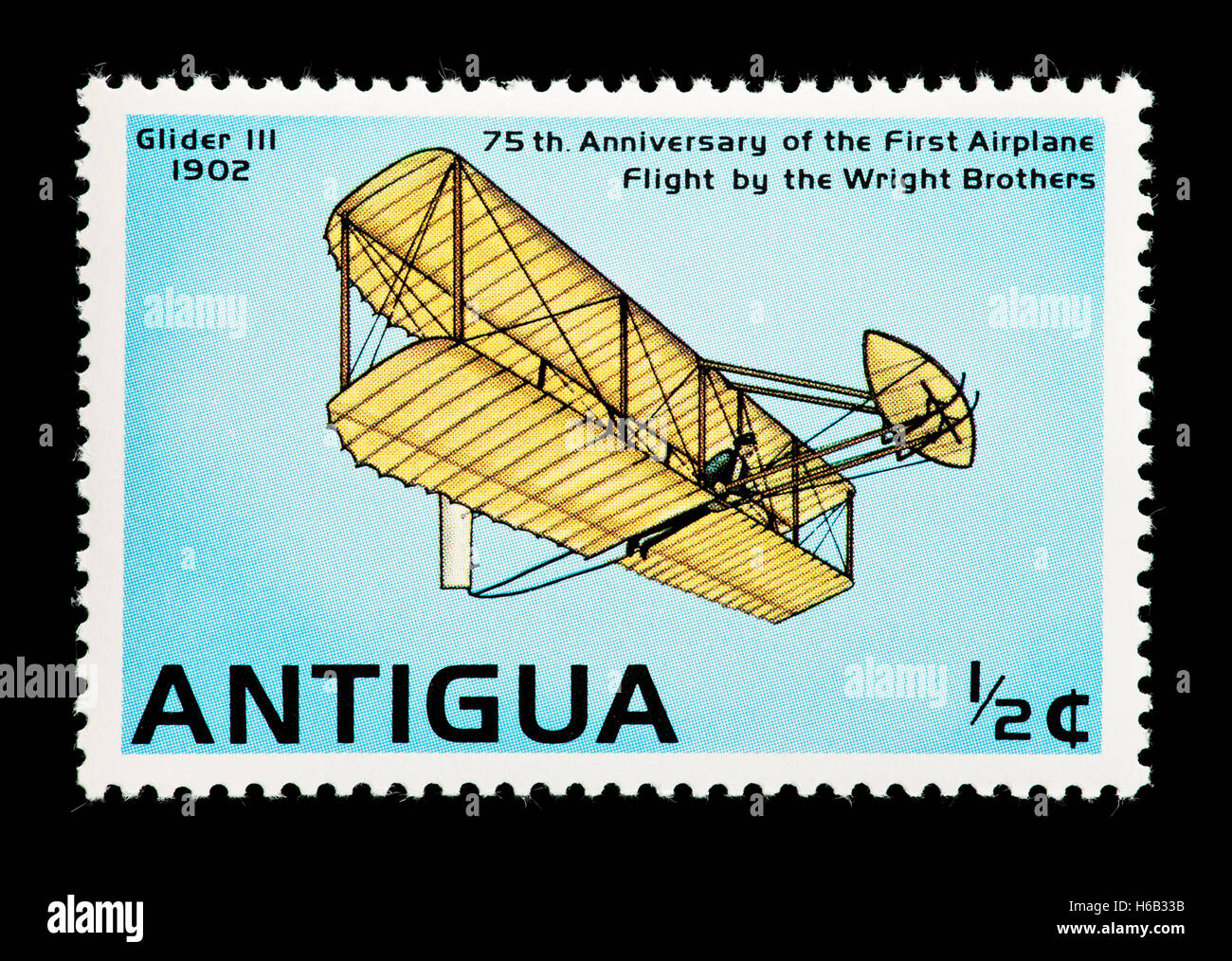 Postage stamp from Antigua depicting a Wright Brothers glider aircraft, 75'th anniversary of the Wright Brothers first flight. Stock Photo