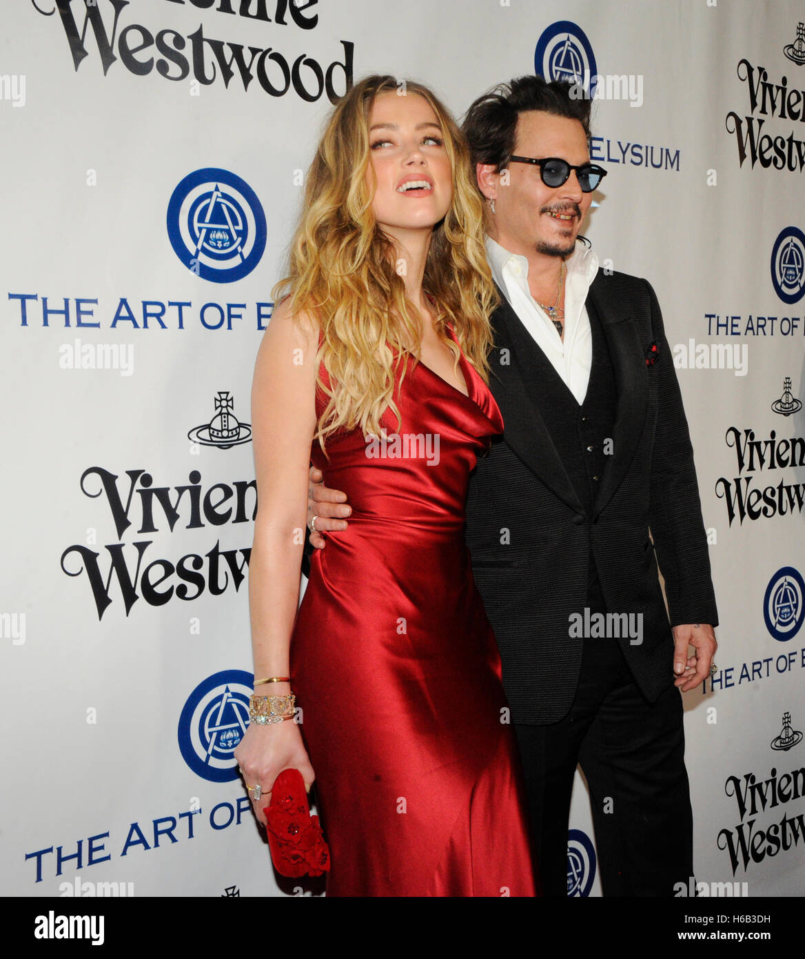 Actors Amber Heard (L) and Johnny Depp attend The Art of Elysium 2016