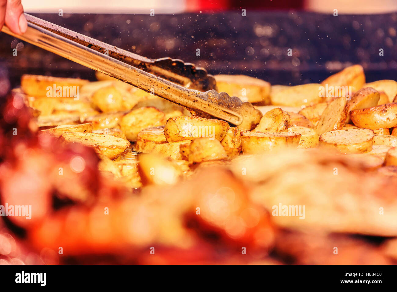 Preparing Grilled Potatoes On Barbecue Stock Photo