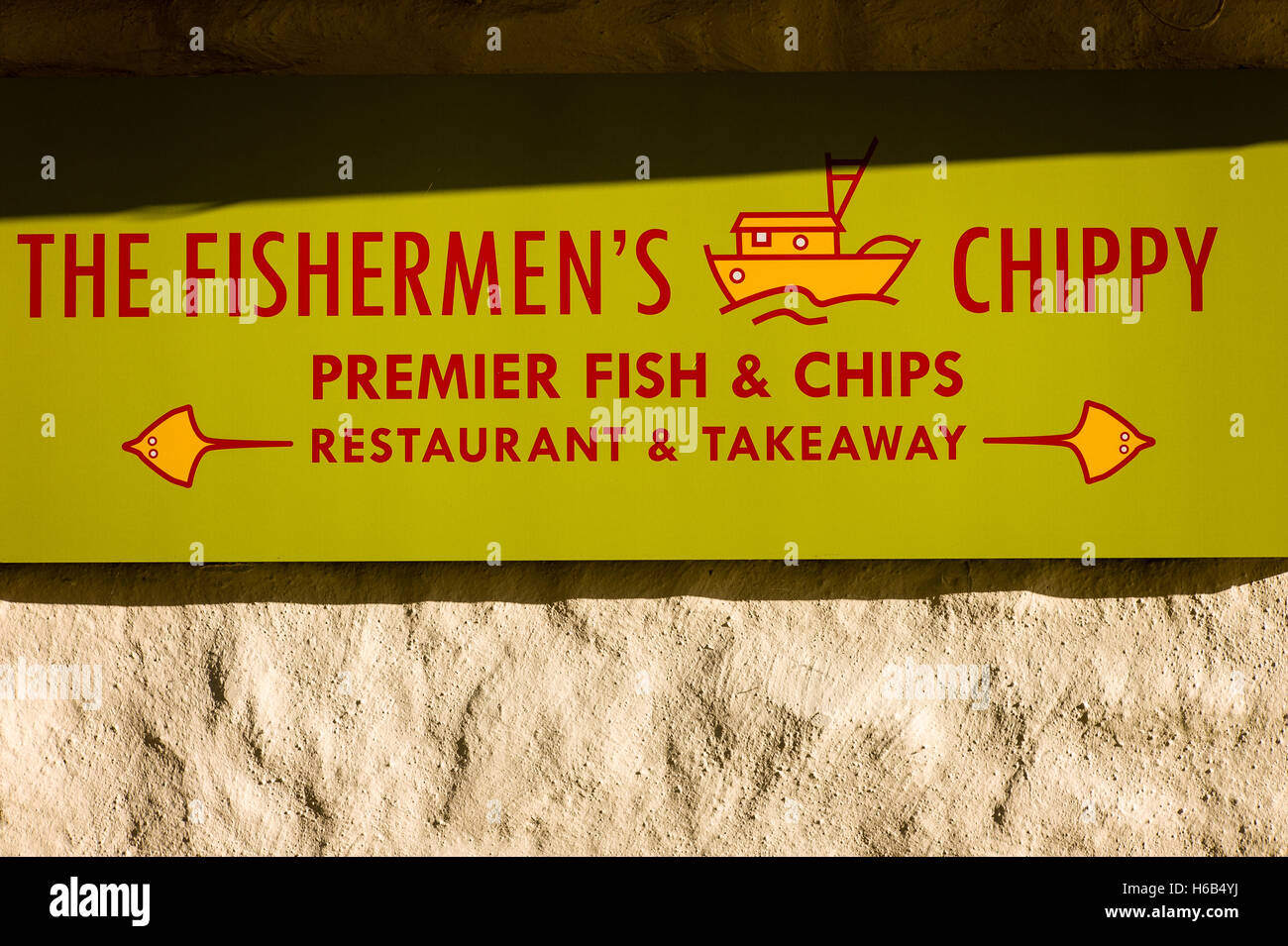 Sign above a fish and chip shop in a Cornish fishinng village in UK Stock Photo