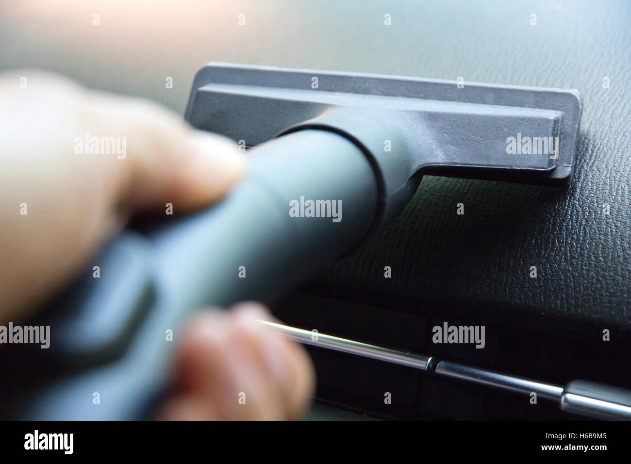 Vacuuming car interior Stock Photo Alamy