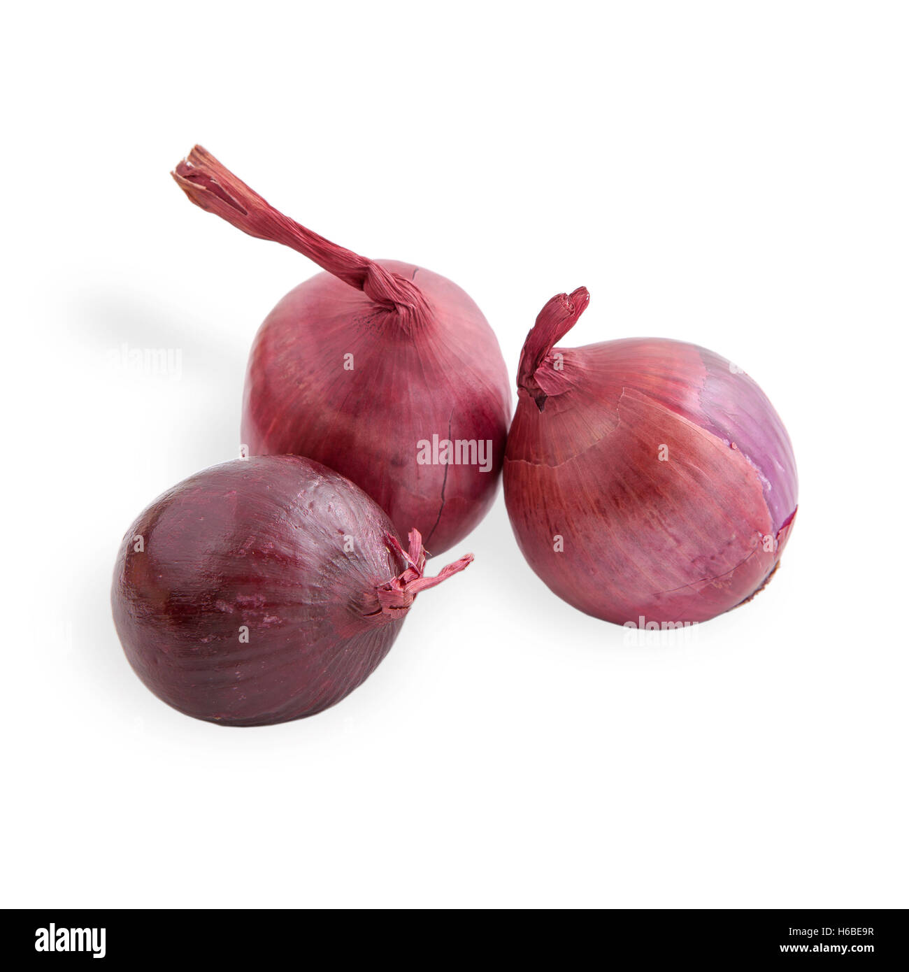 Three Red purple onions on white background, food background Stock Photo