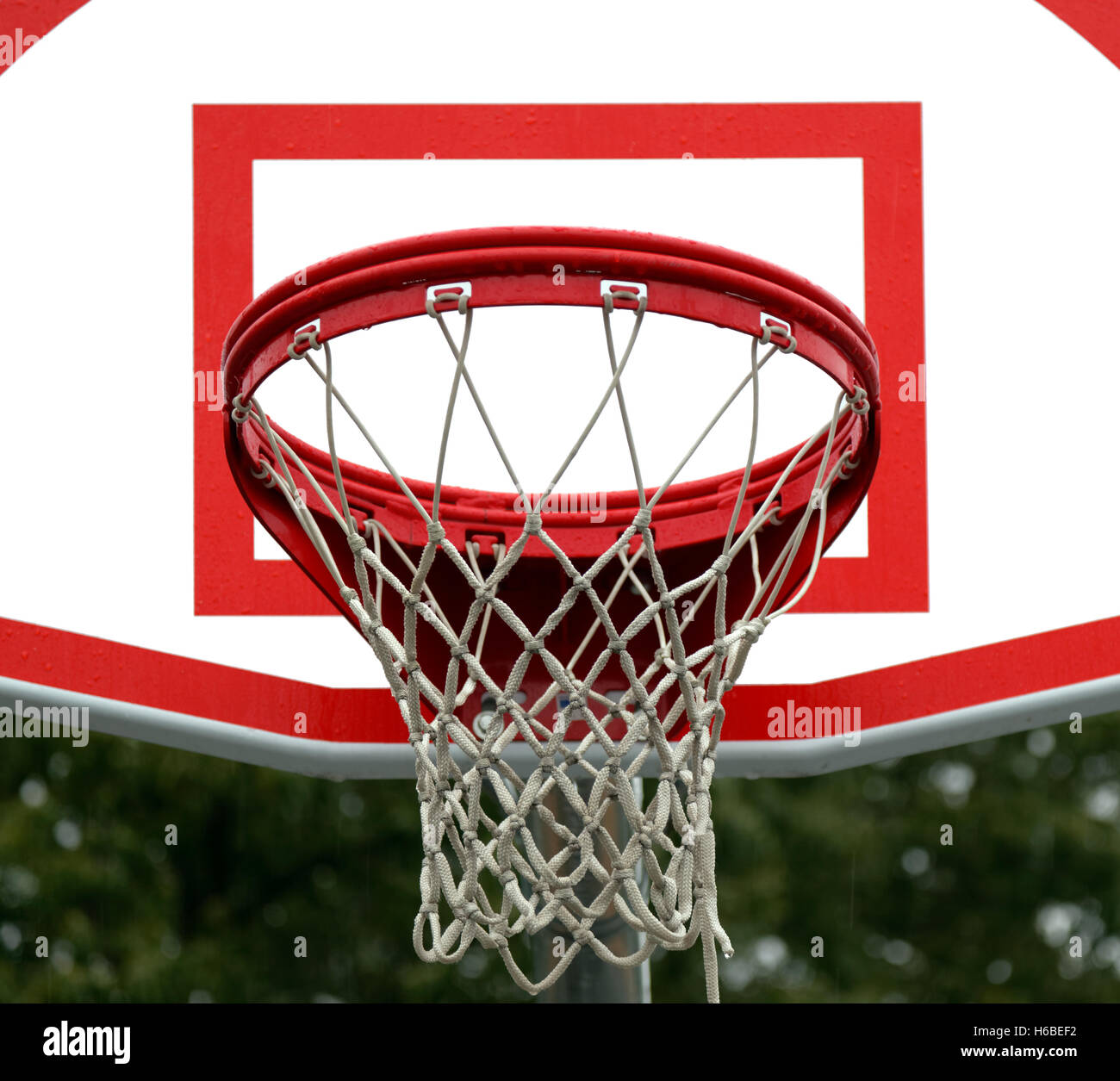Close-up of new basketball pole, hoop, backboard, and net. Stock Photo