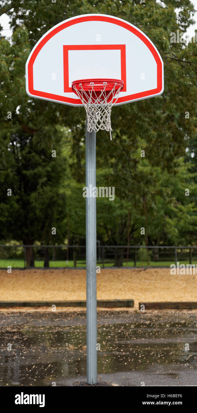 New basketball pole, hoop, backboard, and net on a rainy day Stock Photo Alamy