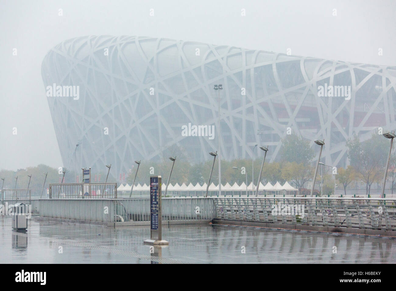 The Beijing National Olympic Stadium, the Bird's Nest,  in the rain and mist Stock Photo