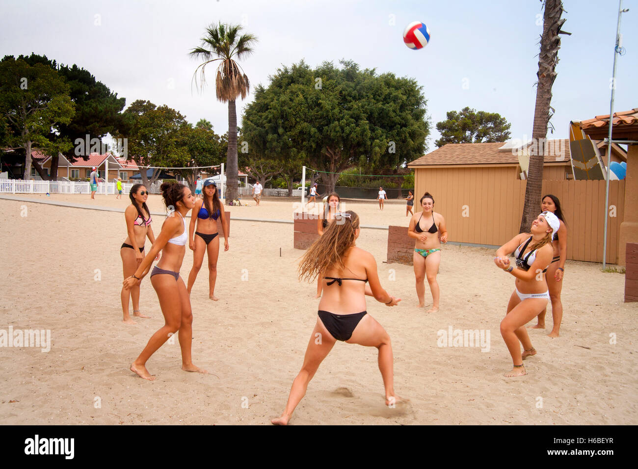 A group of overweight teenage girls in bikinis play volleyball without a  net in Newport Beach, CA Stock Photo - Alamy
