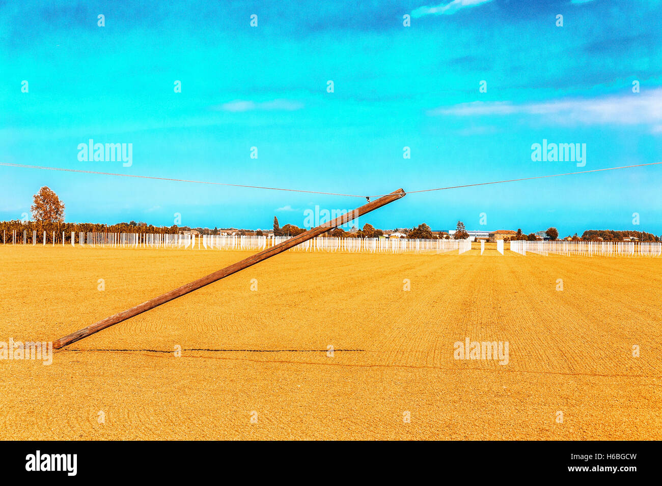 pole that is falling and is supported only by the phone cord in the