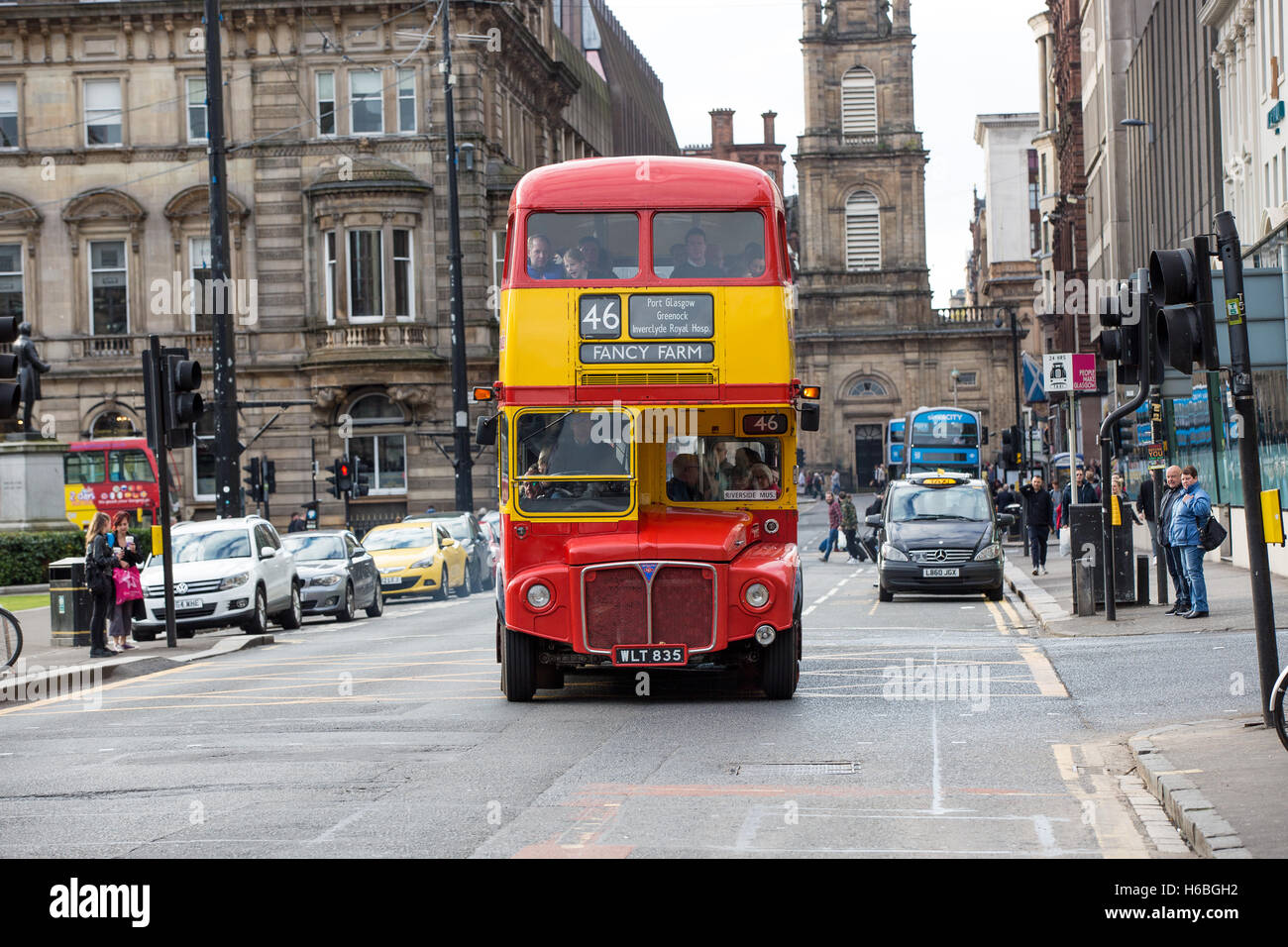 A vintage bus travels through Glasgow City Centre Stock Photo Alamy