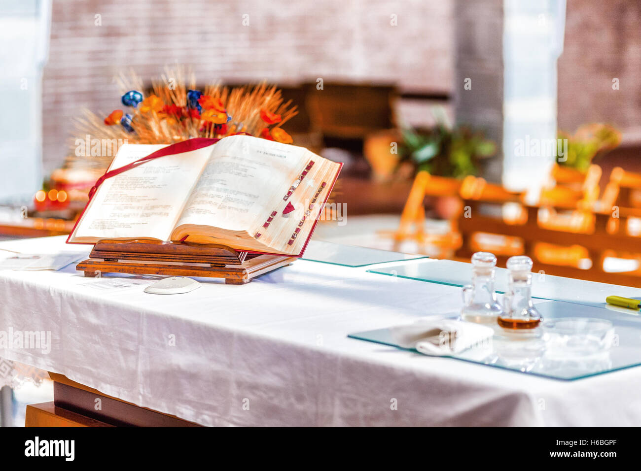 the spirituality of an open Bible on the altar of the Catholic Church Stock Photo