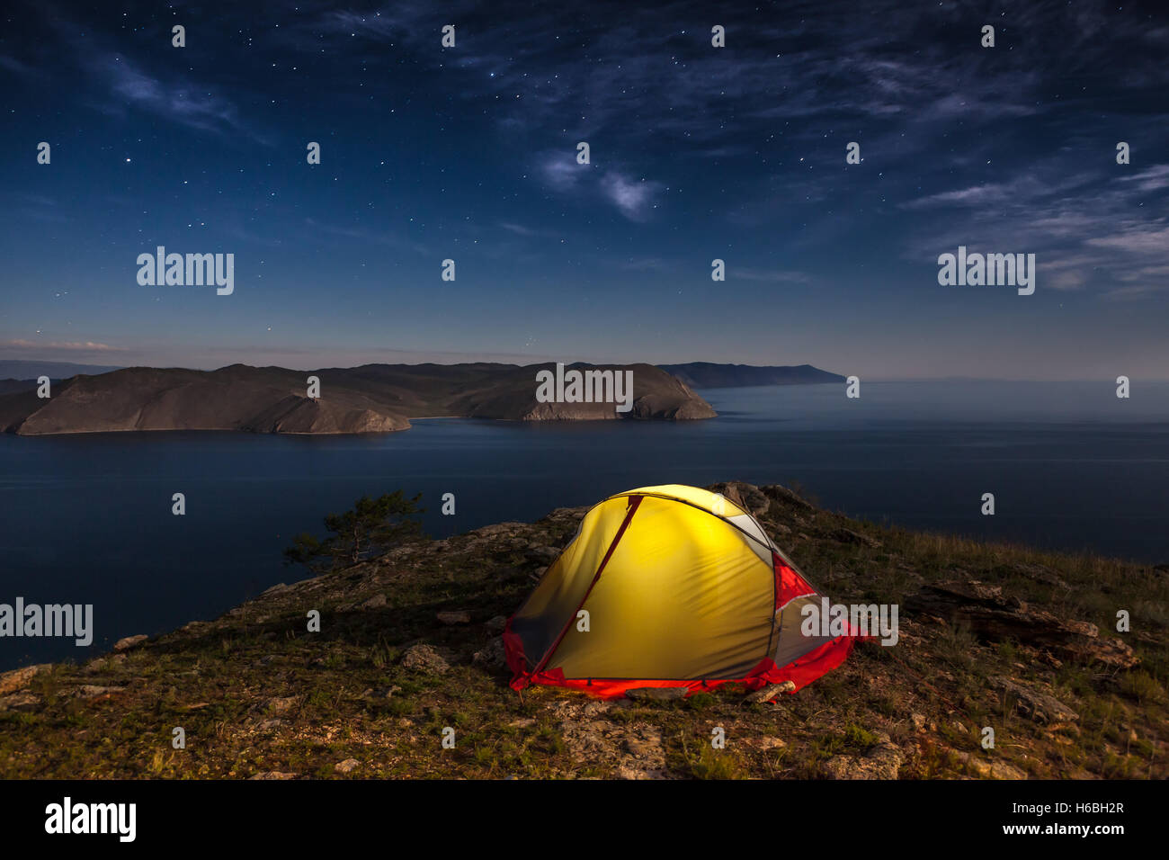 Tent against mountain at night Stock Photo
