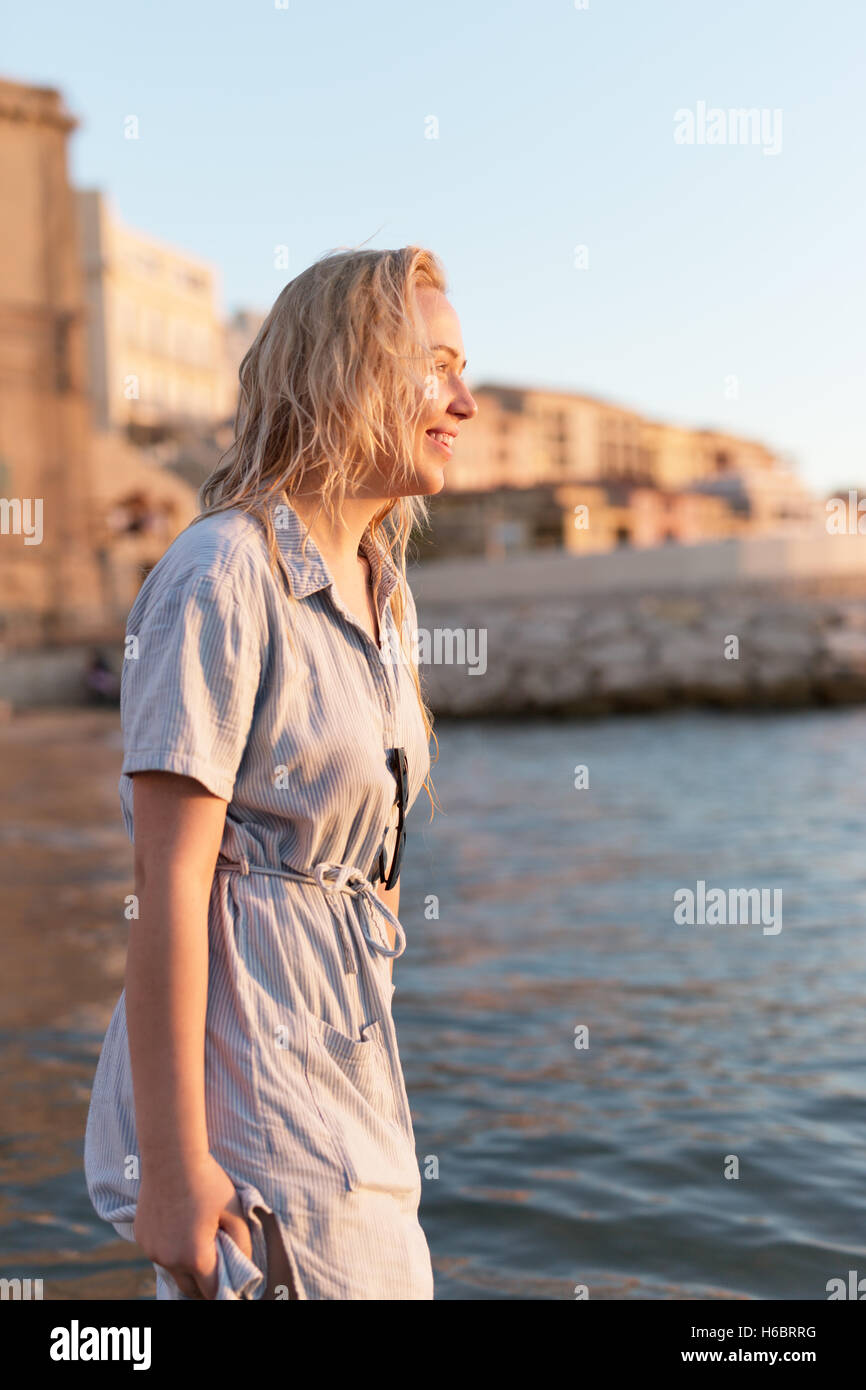 Happy carefree woman dancing at sunset on the beach. Happy free ...