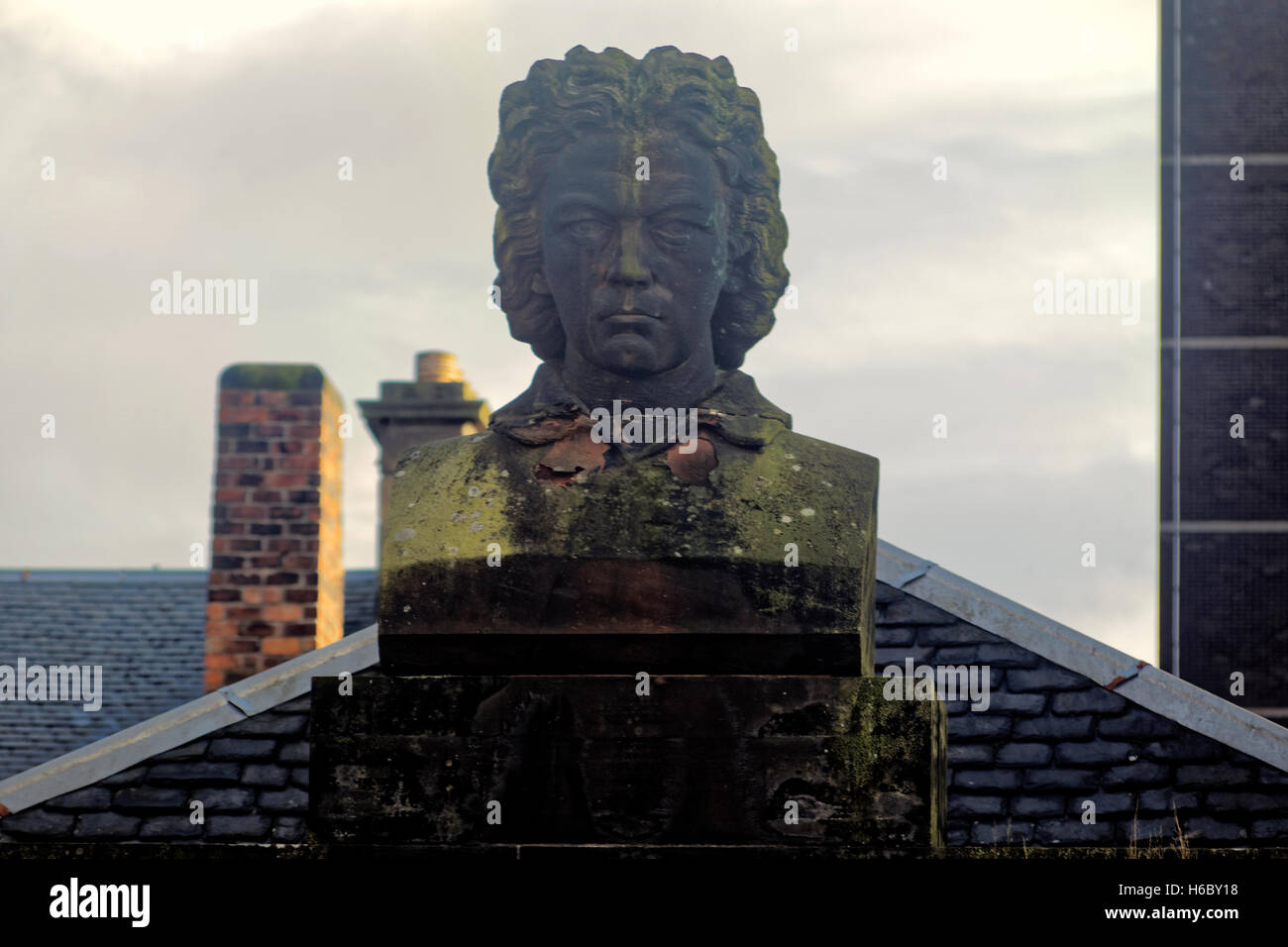 Beethoven gazes out over Renfrew Street on old building cornice of music shop once T A Ewing's Piano and Harmonium Emporium. Stock Photo
