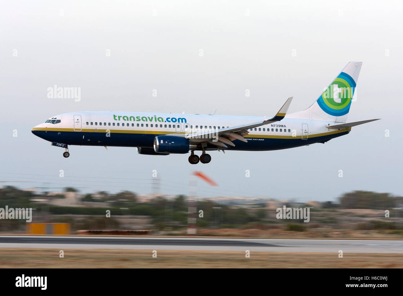 Transavia Airlines (Miami Air) Boeing 737-8Q8 [N739MA] on short finals runway 32 after sunset. Stock Photo