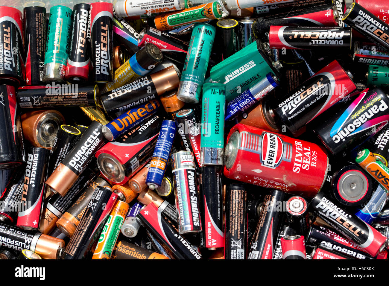 Large collection of used carbon zinc and alkaline dry cell batteries awaiting recycling UK Stock