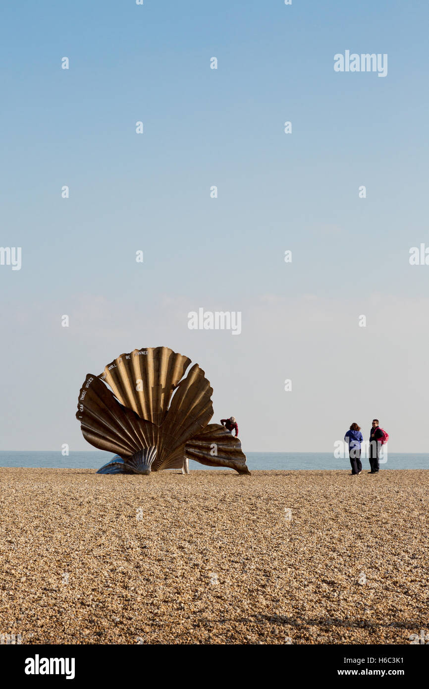 People looking at the Scallop shell sculpture by Maggi Hambling on Aldeburgh beach, Aldeburgh, Suffolk coast, England UK Stock Photo